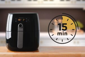 Friggitrice ad aria nera e simbolo cronometro "15 minuti"